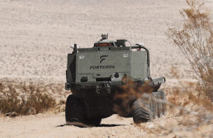 A Forterra truck driving through a desert.