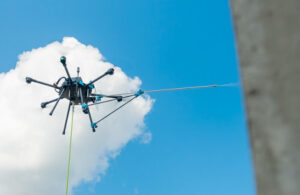 lucid bots drone flying next to a building