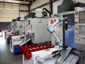 a fleet of UR cobot arms working in machine tending applications.
